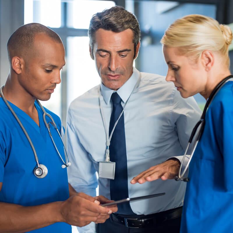 Doctors looking at patient notes